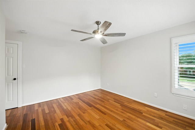 1211 Villmont Ln, Houston, TX 77077 - spare room featuring wood finished floors, a smoke detector, and a ceiling fan
