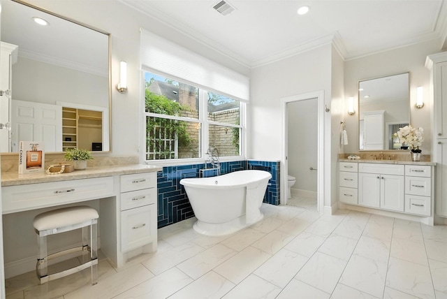 1211 Villmont Ln, Houston, TX 77077 - full bath with ornamental molding, a freestanding bath, vanity, marble finish floors, and recessed lighting
