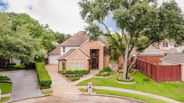 1211 Villmont Ln, Houston, TX 77077 - view of front facade featuring brick siding, concrete driveway, a garage, and a shingled roof