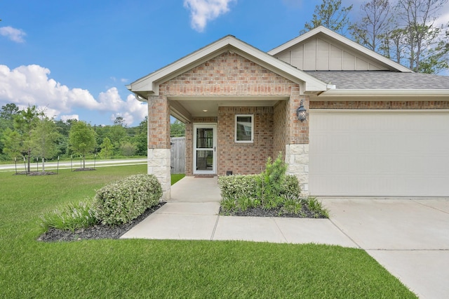 18529 Meadow Point Ln, Montgomery, TX 77316 - view of front of property with a front yard, brick siding, an attached garage, driveway, and roof with shingles