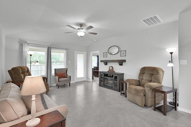 18529 Meadow Point Ln, Montgomery, TX 77316 - living room with a ceiling fan, a fireplace, light tile patterned floors, and lofted ceiling
