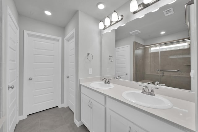 18529 Meadow Point Ln, Montgomery, TX 77316 - full bathroom featuring tile patterned flooring, double vanity, a shower stall, and recessed lighting