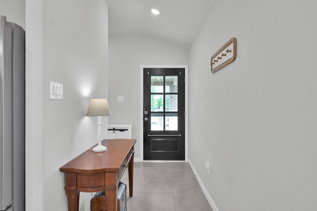 18529 Meadow Point Ln, Montgomery, TX 77316 - entryway featuring lofted ceiling and light tile patterned flooring