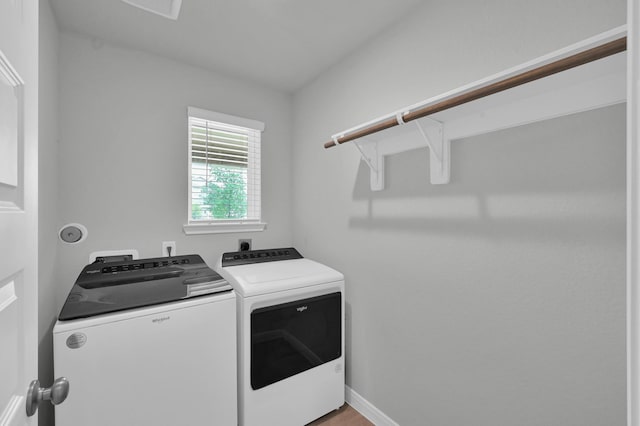 18529 Meadow Point Ln, Montgomery, TX 77316 - laundry area with washing machine and clothes dryer and baseboards