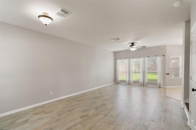 12106 Hawthorne Hill Cir, Humble, TX 77346 - unfurnished room with a smoke detector, ceiling fan, and light wood-style floors