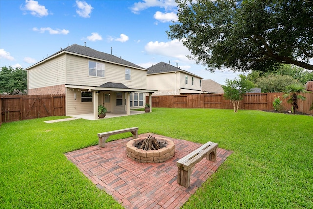 12106 Hawthorne Hill Cir, Humble, TX 77346 - rear view of property featuring a patio, a fire pit, a fenced backyard, and a shingled roof
