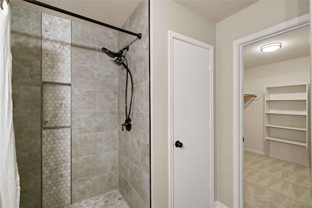 12106 Hawthorne Hill Cir, Humble, TX 77346 - full bath featuring a shower stall, a textured ceiling, and a spacious closet