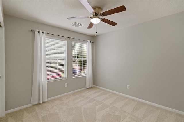 12106 Hawthorne Hill Cir, Humble, TX 77346 - spare room with light carpet, ceiling fan, and a textured ceiling
