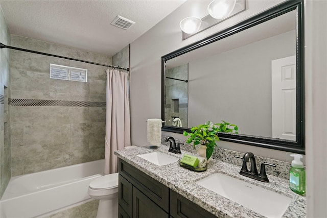 12106 Hawthorne Hill Cir, Humble, TX 77346 - bathroom featuring shower / bath combo with shower curtain, double vanity, tile patterned floors, and a textured ceiling