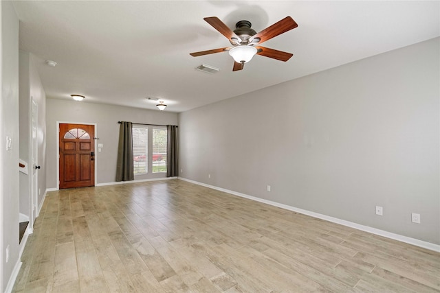 12106 Hawthorne Hill Cir, Humble, TX 77346 - empty room with light wood finished floors, ceiling fan, and a smoke detector