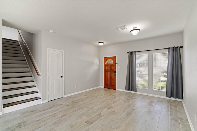 12106 Hawthorne Hill Cir, Humble, TX 77346 - foyer with light wood finished floors and stairway