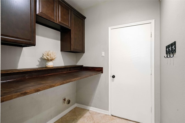 12106 Hawthorne Hill Cir, Humble, TX 77346 - laundry area featuring baseboards and light tile patterned flooring