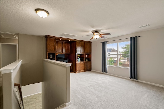 12106 Hawthorne Hill Cir, Humble, TX 77346 - kitchen featuring a ceiling fan, a textured ceiling, and light colored carpet