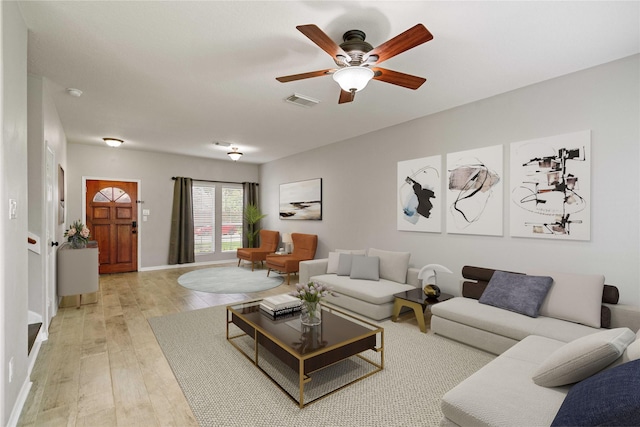 12106 Hawthorne Hill Cir, Humble, TX 77346 - living area with light wood finished floors and ceiling fan