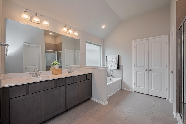 25446 Fossa Dr, Tomball, TX 77375 - full bathroom featuring a shower stall, double vanity, vaulted ceiling, a bath, and tile patterned floors