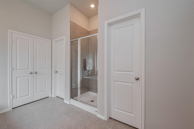 25446 Fossa Dr, Tomball, TX 77375 - bathroom featuring a shower stall and tile patterned flooring