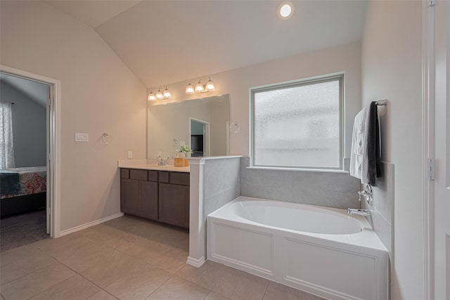 25446 Fossa Dr, Tomball, TX 77375 - ensuite bathroom with vanity, vaulted ceiling, a bath, and tile patterned floors