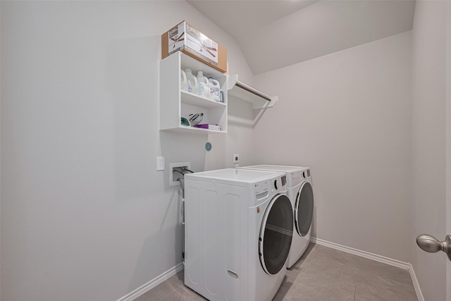 25446 Fossa Dr, Tomball, TX 77375 - laundry area with independent washer and dryer and light tile patterned floors
