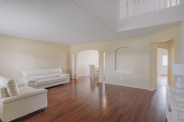 18107 Mayfield Meadow Ln, Richmond, TX 77407 - living room with arched walkways and wood finished floors