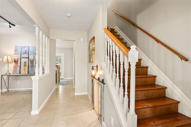 2151 Middle Creek Dr, Houston, TX 77339 - staircase with tile patterned flooring and rail lighting