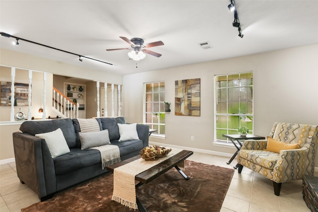 2151 Middle Creek Dr, Houston, TX 77339 - living area with rail lighting, tile patterned floors, stairs, and a ceiling fan