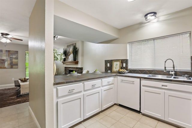 2151 Middle Creek Dr, Houston, TX 77339 - kitchen featuring light tile patterned flooring, tile counters, ceiling fan, and white cabinets