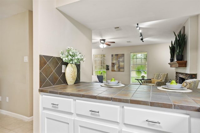 2151 Middle Creek Dr, Houston, TX 77339 - kitchen featuring a ceiling fan, tile counters, track lighting, and open floor plan