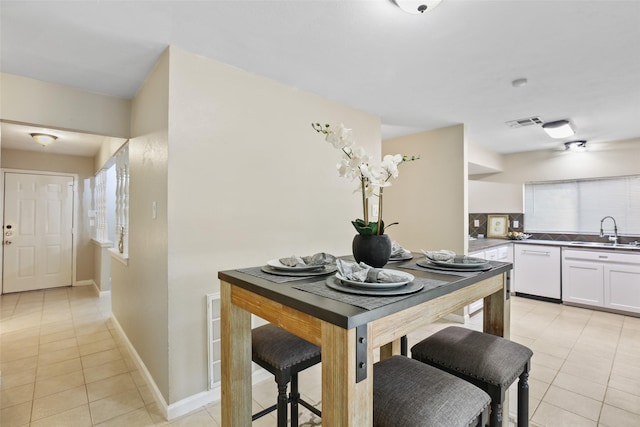 2151 Middle Creek Dr, Houston, TX 77339 - kitchen with light tile patterned flooring, white dishwasher, white cabinets, and dark countertops