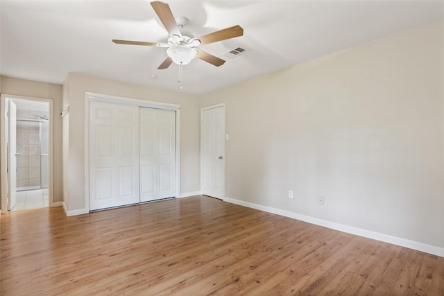 2151 Middle Creek Dr, Houston, TX 77339 - unfurnished bedroom featuring light wood-type flooring, a closet, ensuite bath, and a ceiling fan