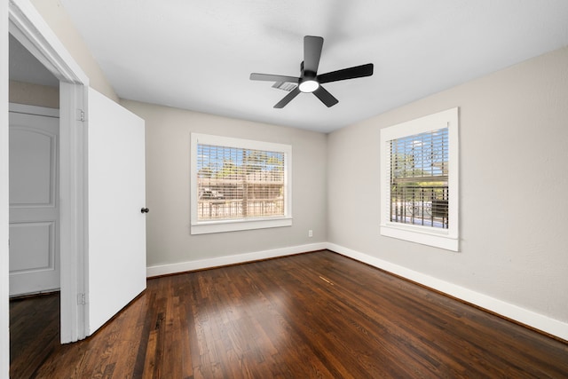 5519 Chapman St, Houston, TX 77009 - unfurnished bedroom featuring multiple windows, wood finished floors, and ceiling fan