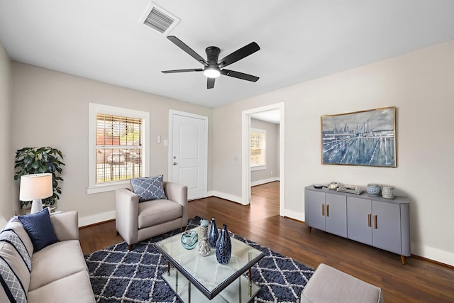 5519 Chapman St, Houston, TX 77009 - living room with ceiling fan and dark wood-style flooring