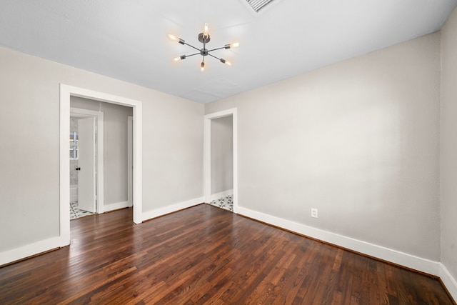 5519 Chapman St, Houston, TX 77009 - unfurnished room with a chandelier and dark wood-style floors