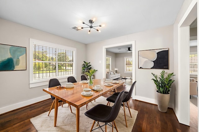 5519 Chapman St, Houston, TX 77009 - dining room with dark wood-type flooring and a chandelier