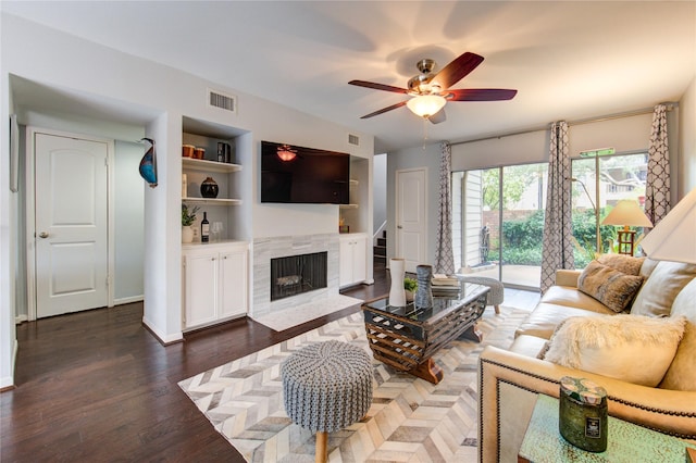 1964 Augusta Dr, Houston, TX 77057 - living room with ceiling fan, a fireplace, wood finished floors, and built in features