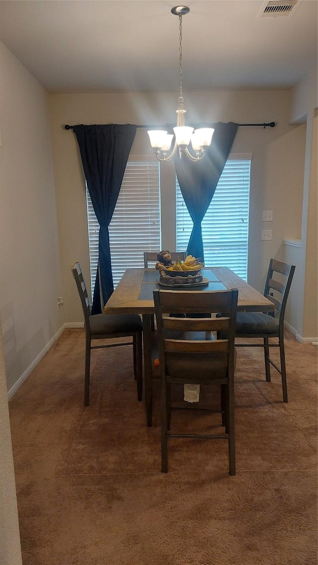 15318 Laceleaf Trl, Houston, TX 77044 - dining space with light carpet and a chandelier