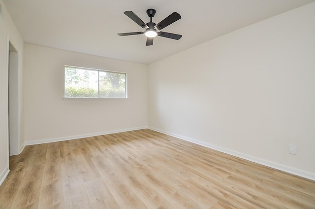 10623 Longmont Dr, Houston, TX 77042 - spare room featuring light wood-style flooring and a ceiling fan