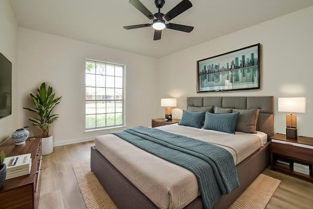 10623 Longmont Dr, Houston, TX 77042 - bedroom with light wood-style flooring and ceiling fan