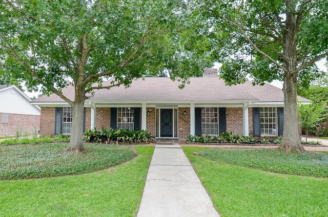 10623 Longmont Dr, Houston, TX 77042 - single story home with brick siding, a front lawn, a chimney, and a shingled roof