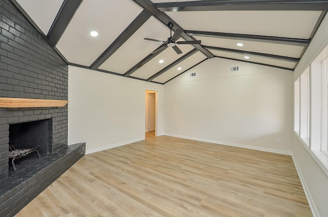 10623 Longmont Dr, Houston, TX 77042 - unfurnished living room with ceiling fan, light wood-style flooring, a brick fireplace, and recessed lighting