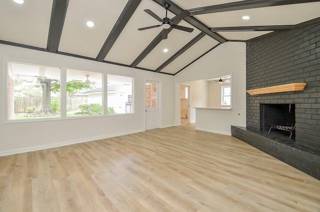 10623 Longmont Dr, Houston, TX 77042 - unfurnished living room with a ceiling fan, a fireplace, recessed lighting, and light wood finished floors