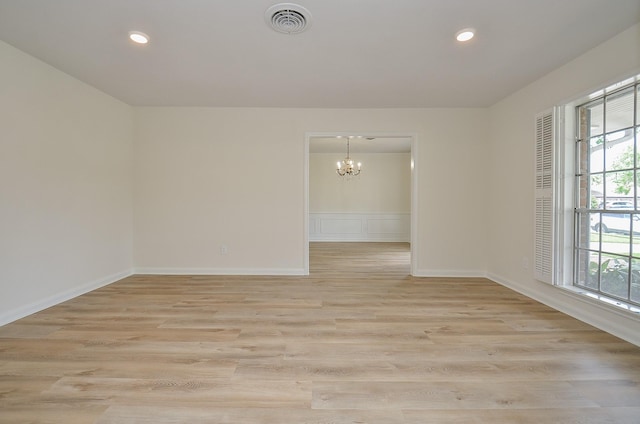 10623 Longmont Dr, Houston, TX 77042 - empty room with a chandelier, light wood-style floors, and recessed lighting