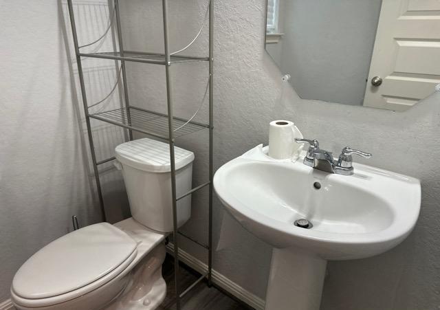 12906 Awuzie Trl, San Antonio, TX 78254 - bathroom with toilet and a textured wall