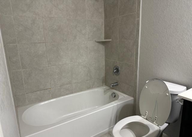 12906 Awuzie Trl, San Antonio, TX 78254 - bathroom featuring vanity, bathing tub / shower combination, and a textured wall