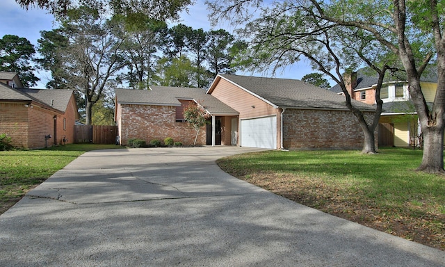 22635 River Birch Dr, Tomball, TX 77375 - view of front facade featuring a garage, driveway, brick siding, and roof with shingles