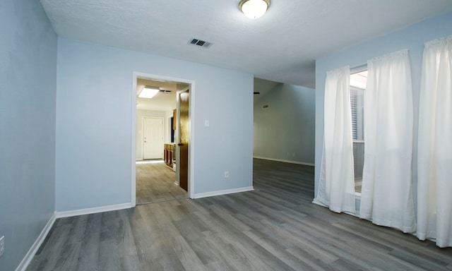 22635 River Birch Dr, Tomball, TX 77375 - empty room featuring wood finished floors and baseboards