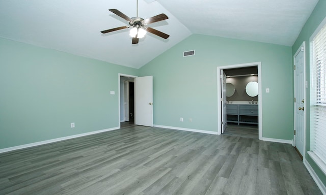 22635 River Birch Dr, Tomball, TX 77375 - unfurnished bedroom featuring wood finished floors, lofted ceiling, connected bathroom, and ceiling fan
