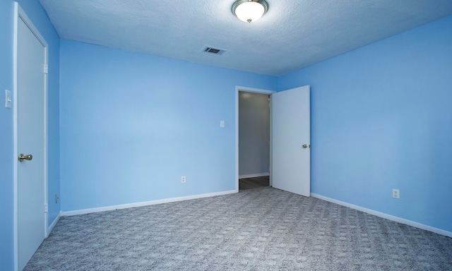 22635 River Birch Dr, Tomball, TX 77375 - unfurnished bedroom featuring carpet flooring and a textured ceiling