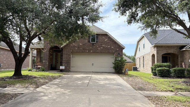 20530 Keegans Ledge Ln, Cypress, TX 77433 - view of front of home featuring brick siding, concrete driveway, and roof with shingles
