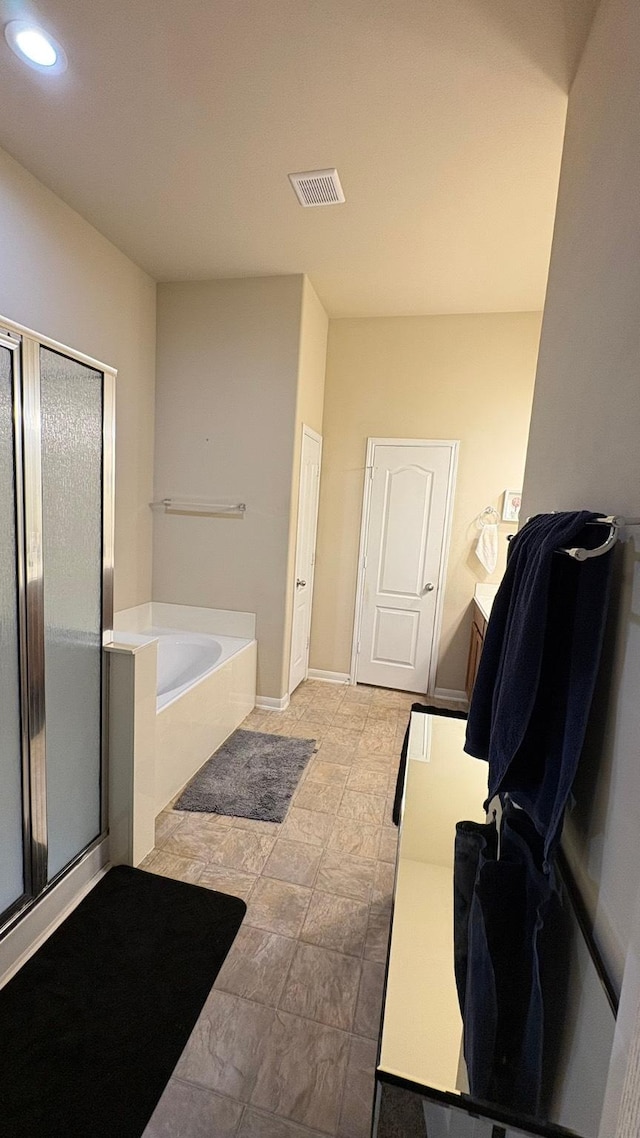 20530 Keegans Ledge Ln, Cypress, TX 77433 - bathroom with a garden tub, a shower stall, and recessed lighting