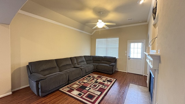 20530 Keegans Ledge Ln, Cypress, TX 77433 - living area featuring crown molding, wood finished floors, ceiling fan, and a fireplace with flush hearth